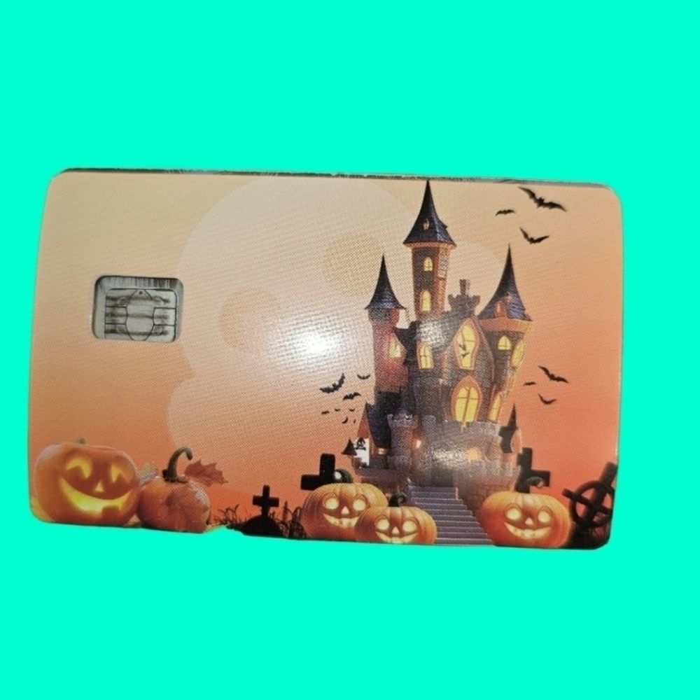 Haunted house with pumpkins credit card skin for small chip cards